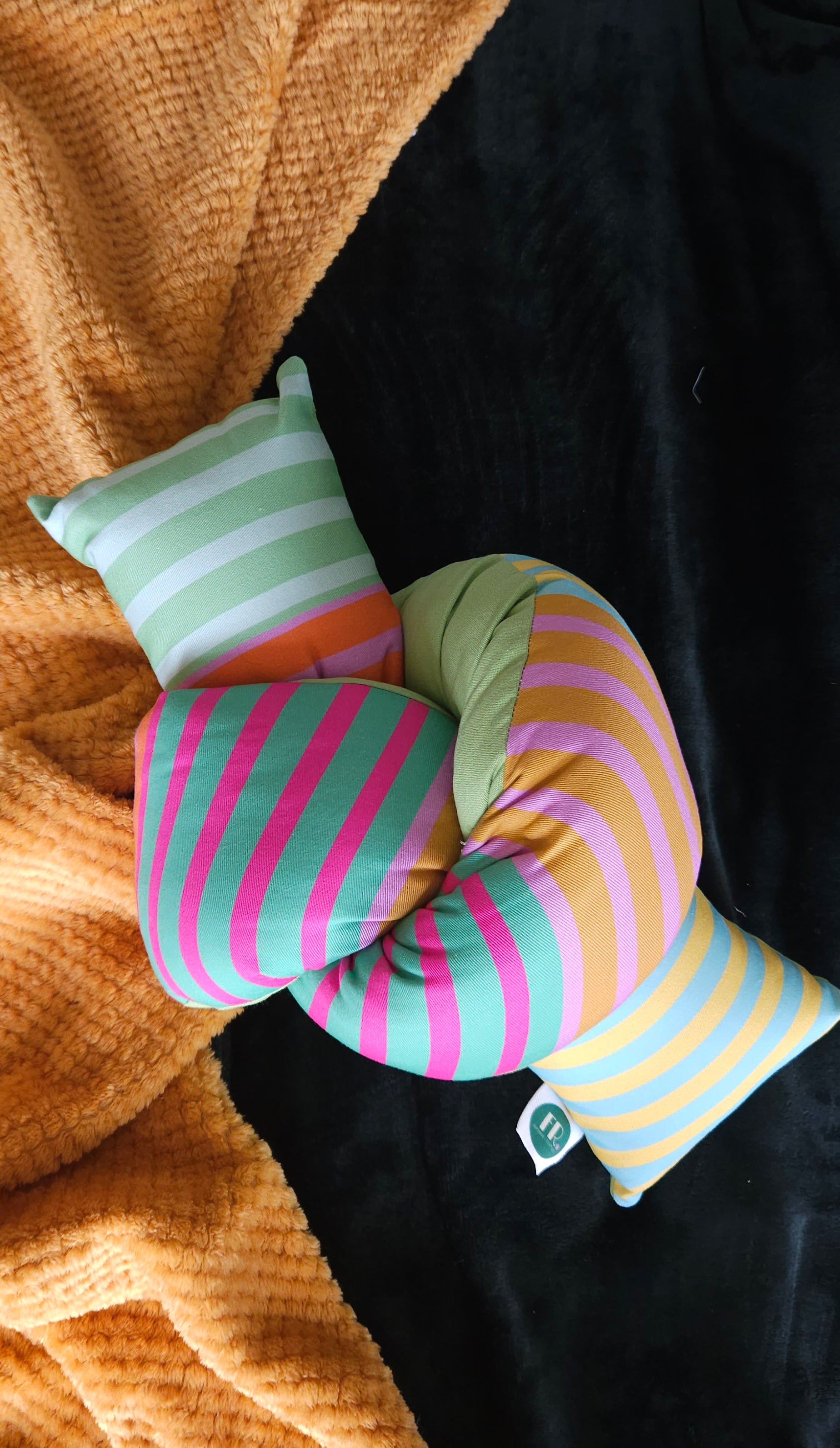 Multi beach stripe cuddle loop plush pillow – Fawziyah Raja surface ...